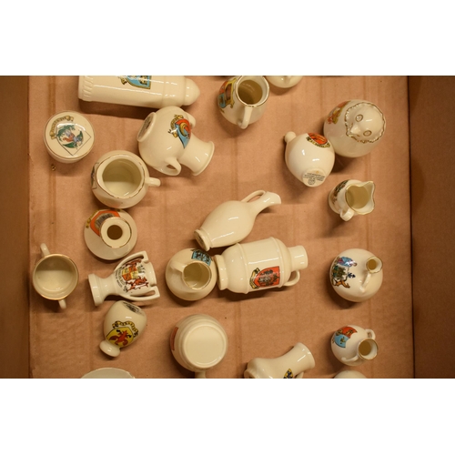 4 - A mixed collection of crested china items to include vases, jugs, trinkets, a pair of stirrups, a sh... 