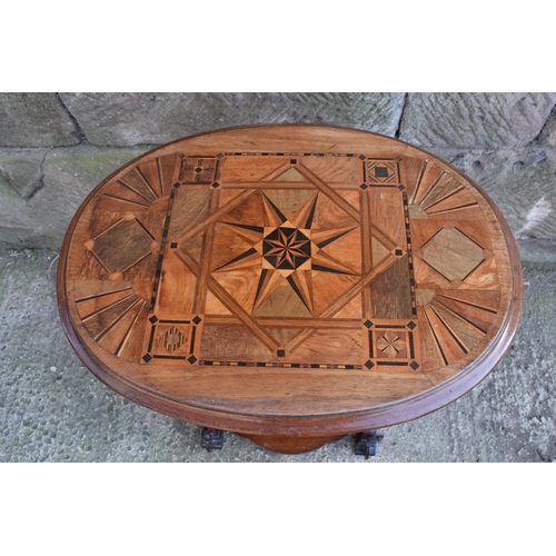 341 - An early 20th century sewing table with marquetry decoration in the Aesthetic Movement style with re... 