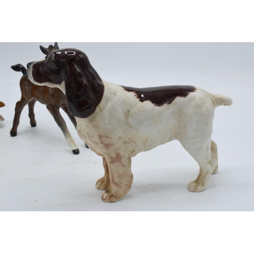 110 - A trio of Beswick animals to include barn owl 1046, large brown outstretched foal and cocker spaniel... 