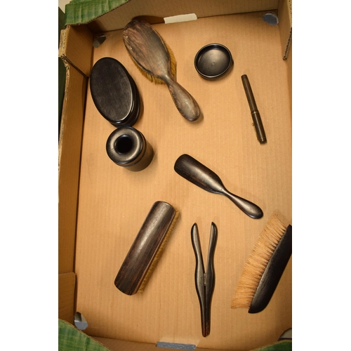 255 - A collection of ebonised wooden items to include brushes, pots and trinkets etc (Qty).