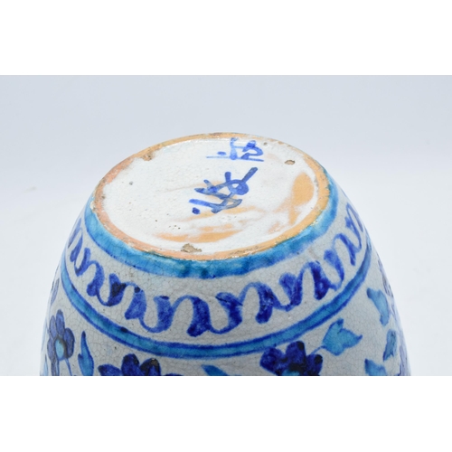 198 - A 19th century blue and white pottery Iznik or similar vase with crackle glaze effect. 25cm tall.