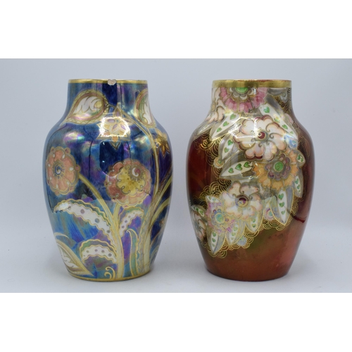 190 - A pair of Royal Winton bulbous lustre vase both with floral designs on a blue and red background (2)... 