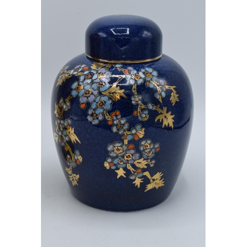 189 - Royal Winton Grimwades floral and gilt ginger jar on dark blue background together with floral vase ... 