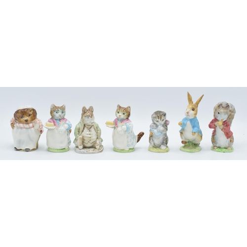 124 - A collection of Beswick Beatrix Potter figures with gold backstamps to include Ribby, Peter Rabbit, ... 