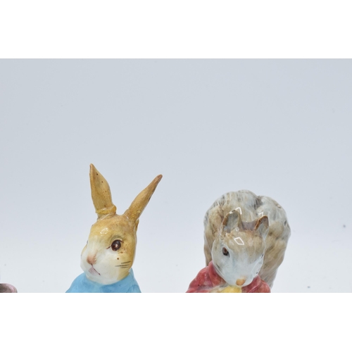 124 - A collection of Beswick Beatrix Potter figures with gold backstamps to include Ribby, Peter Rabbit, ... 