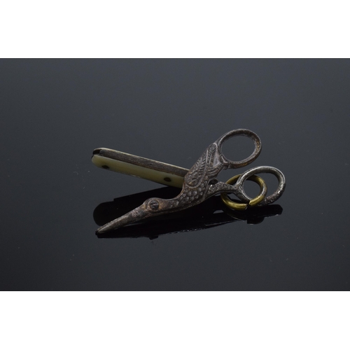 210M - A pair of antique miniature scissors in the form of a stork and a miniature penknife, largest 4cm lo... 