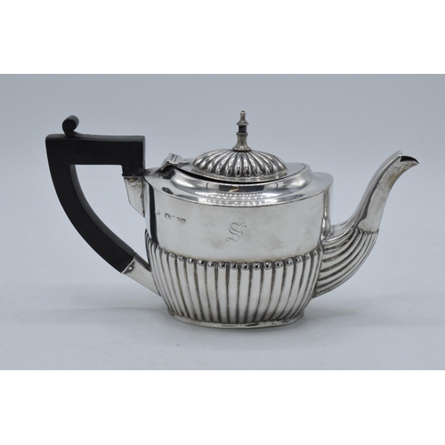 237 - Silver teapot with ebonised handle, engraving to one side. Hallmarks slightly rubbed 1899, Chester 2... 