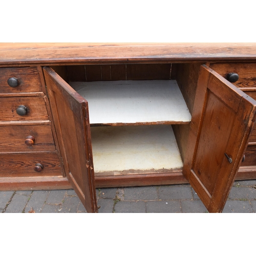 388 - Large Victorian stained pine housekeepers cupboard with sliding doors to top half above a central cu... 