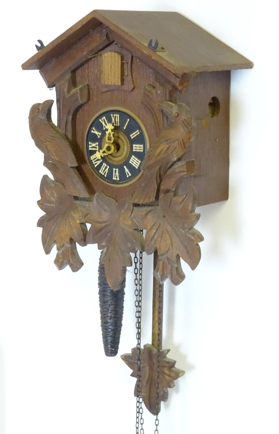 A mid late 20thC cuckoo clock, with ' Regula 'movement and 2 cast