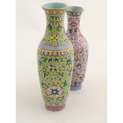 6 - A Chinese famille rose double vase, joined at the shoulder. Each decorated with doucai style scrolli... 
