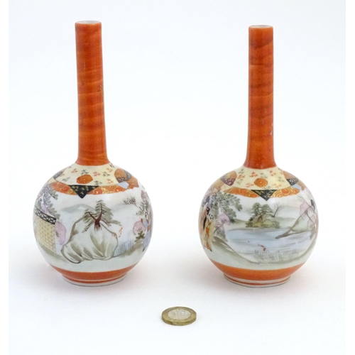 10 - Two Japanese Kutani bottle vases decorated figures in a landscape scenes. Character marks under. App... 