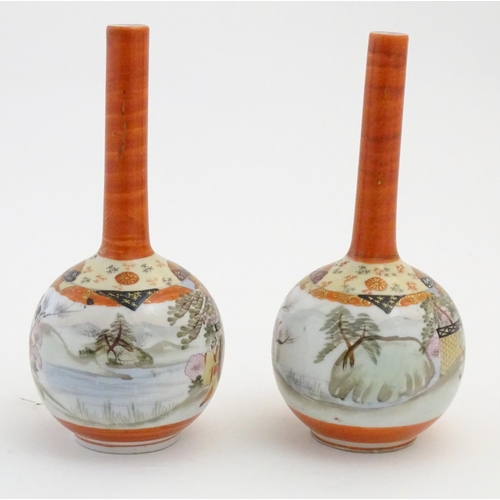 10 - Two Japanese Kutani bottle vases decorated figures in a landscape scenes. Character marks under. App... 