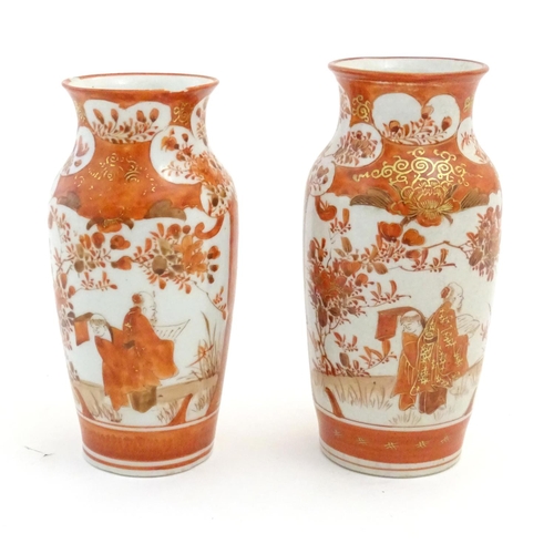 14 - Two Japanese Kutani vases depicting scholars in a landscape, floral and foliate designs and gilt hig... 