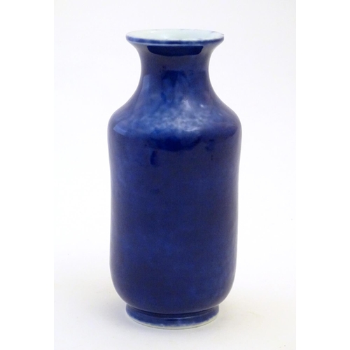 18 - A Chinese vase with a flared rim with a cobalt blue ground. Approx. 7 3/4