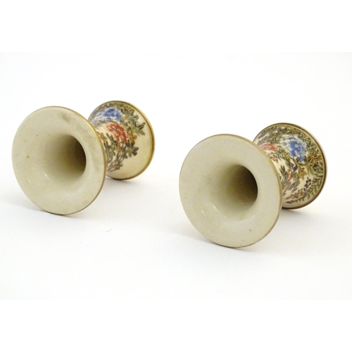 46 - A pair of Japanese miniature Satsuma vases with flared rims and bases, decorated with flowers and fo... 