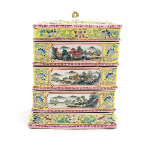 49 - A Chinese famille jaune food container of rectangular form with five tiers with scrolling floral and... 