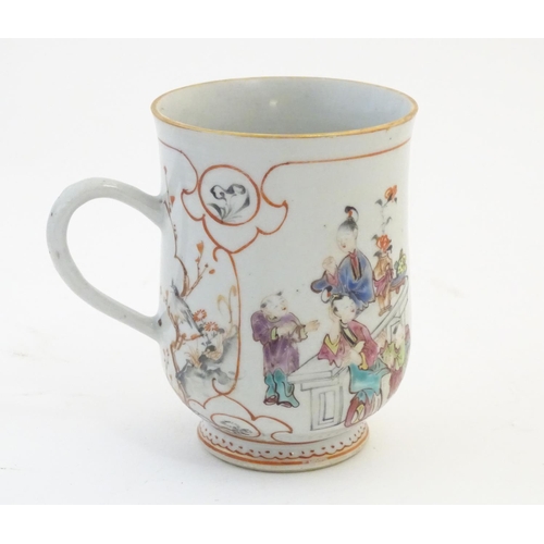 2 - A Chinese export famille rose mug / tankard decorated with figures in a domestic interior scene, and... 