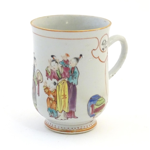 2 - A Chinese export famille rose mug / tankard decorated with figures in a domestic interior scene, and... 