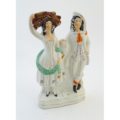 56 - A Staffordshire pottery flat back figural group depicting a harvest couple, the man carries a flagon... 