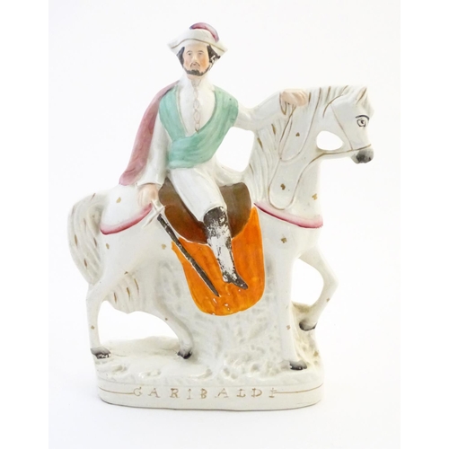 57 - A Staffordshire pottery equestrian flat back depicting Garibaldi on horseback, titled to base. Appro... 