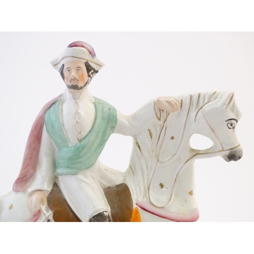 57 - A Staffordshire pottery equestrian flat back depicting Garibaldi on horseback, titled to base. Appro... 
