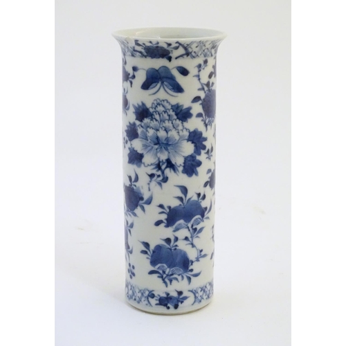 7 - An Oriental blue and white vase of cylindrical form decorated with birds, flowers and foliage. Chara... 