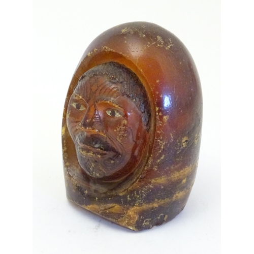 1114 - A Maori carved resin model of the head of a man with painted eyes and Moko facial tattoos. Approx. 4... 