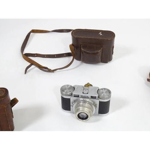 A collection of vintage film cameras, comprising: a Kodak Super Six-20