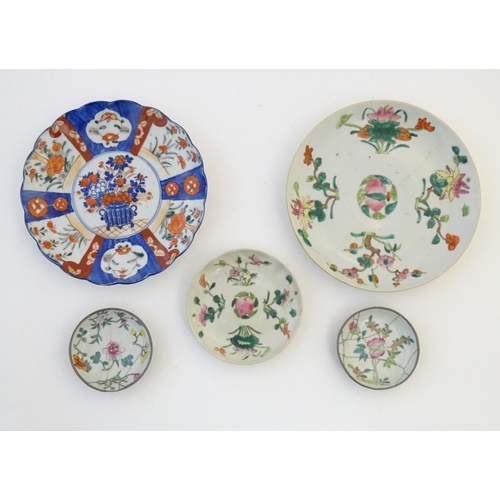 34 - Five assorted Oriental plates to include famille rose plates with floral and foliate detail, each ma... 