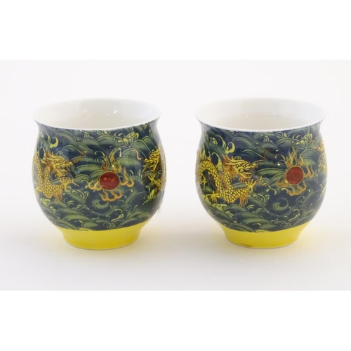 13 - Two Chinese tea bowls of bulbous form with flared rims, with dragon and flaming pearl decoration. Ch... 