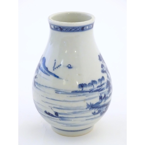 35 - A Chinese blue and white vase decorated with a landscape scene with mountains, pagodas, figures in b... 