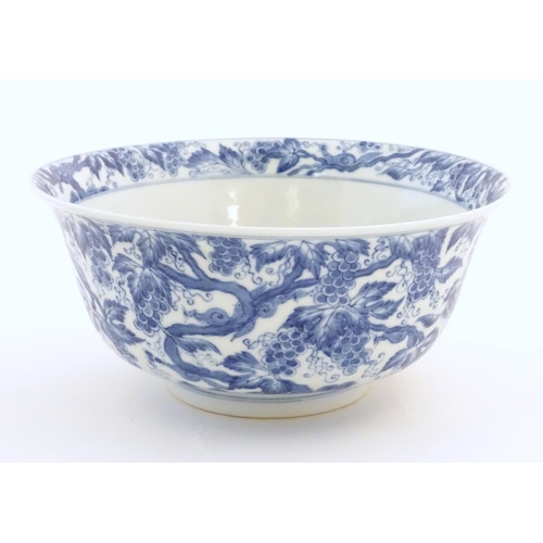 46 - A Chinese blue and white bowl decorated with vine leaves and grapes. Character marks under. Approx. ... 