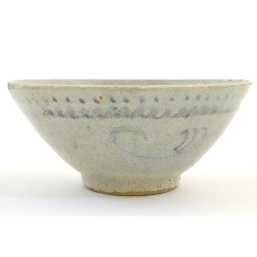 5 - An Oriental earthenware bowl of tapering form with brushwork detail. Approx. 2 1/4