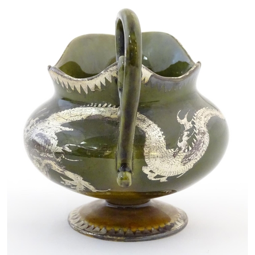 50 - An Oriental pedestal cream jug with gilt dragon detail. Impressed marks under. Approx. 4