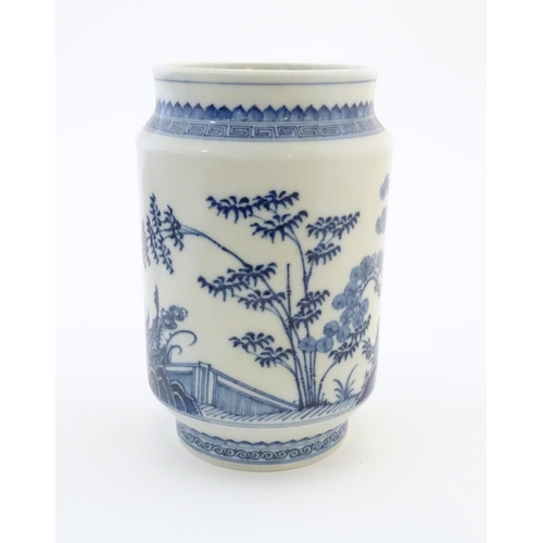 12 - A Chinese blue and white vase of cylindrical form with garden terrace with trees and blossom flowers... 