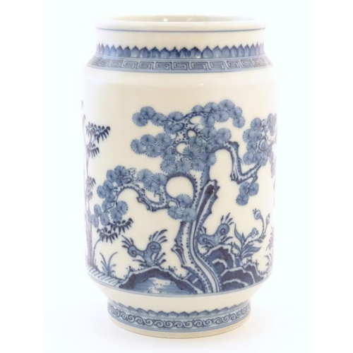 12 - A Chinese blue and white vase of cylindrical form with garden terrace with trees and blossom flowers... 