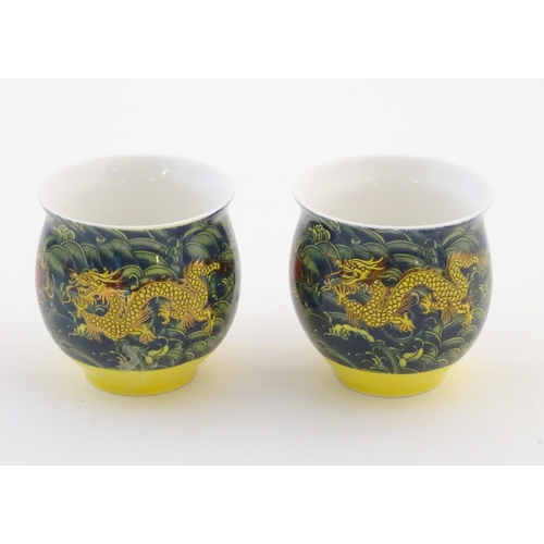 13 - Two Chinese tea bowls of bulbous form with flared rims, with dragon and flaming pearl decoration. Ch... 