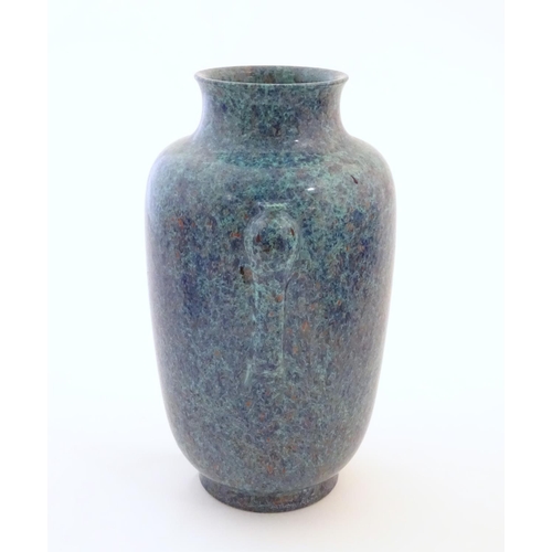 5 - A Chinese vase with moulded twin handles and speckled detail. Impressed character marks under. Appro... 