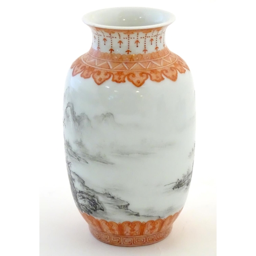 40 - A Chinese small vase with monochrome mountainous landscape detail and orange banded borders. Approx.... 