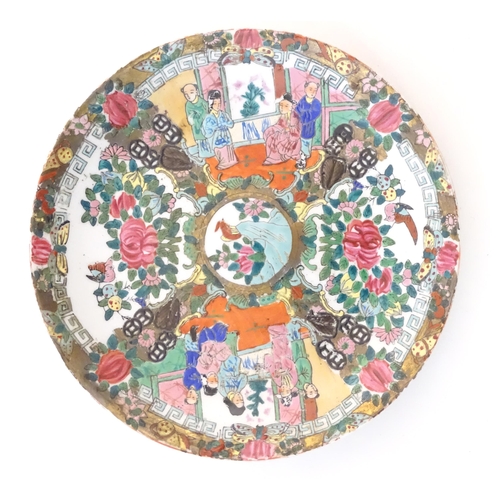 51 - A Chinese / Cantonese plate with panelled decoration depicting flowers, foliage, birds and figures. ... 