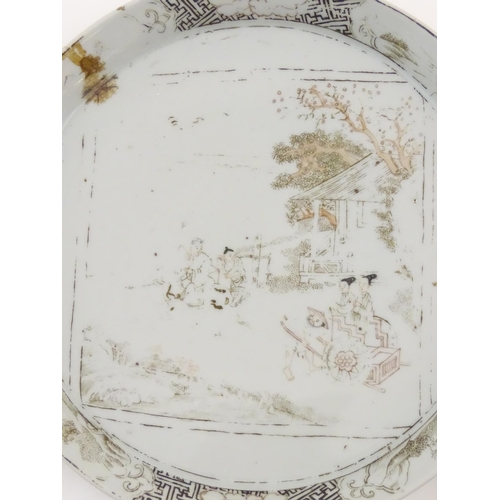 24A - A Chinese blue and white plate decorated with two figures in a landscape scene, the border with ausp... 