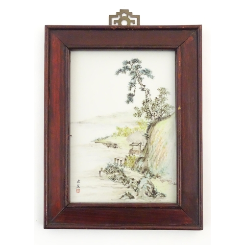 33A - A Chinese porcelain plaque decorated with a coastal scene. Character marks lower left. Approx. 9 1/4... 