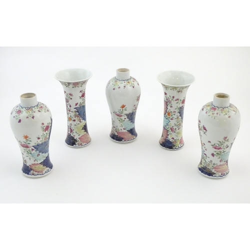 50A - Five Chinese famille rose vases comprising two trumpet vases with floral and foliate detail, and thr... 