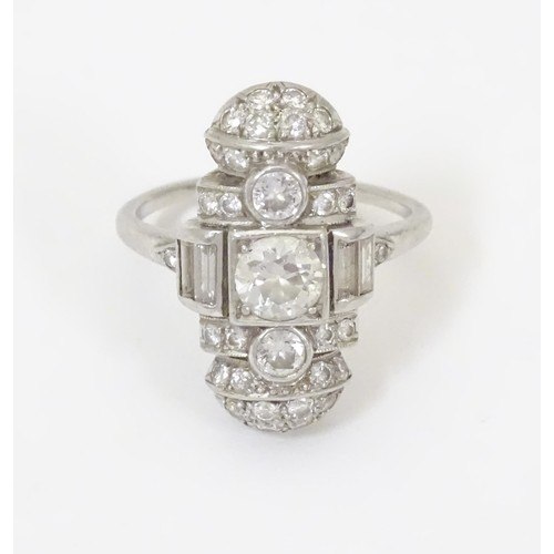 An Art Deco diamond ring set with a profusion of diamonds. The centre stone approx .65ct The overall setting approx. 7/8" x 1/2", ring size approx. I