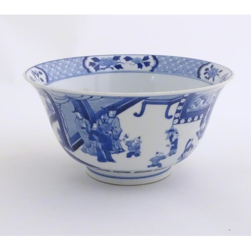 9 - A Chinese blue and white footed bowl with a flared rim, decorated with a scene depicting the enterta... 