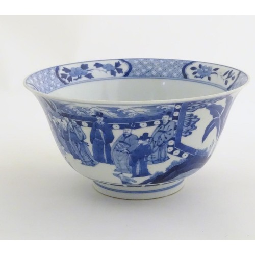 9 - A Chinese blue and white footed bowl with a flared rim, decorated with a scene depicting the enterta... 