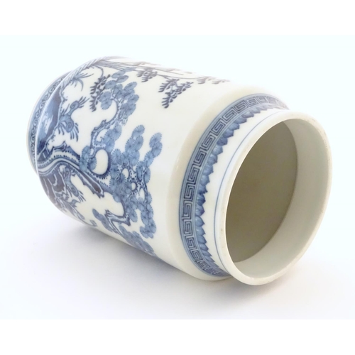 20 - A Chinese blue and white vase of cylindrical form with garden terrace with trees and blossom flowers... 