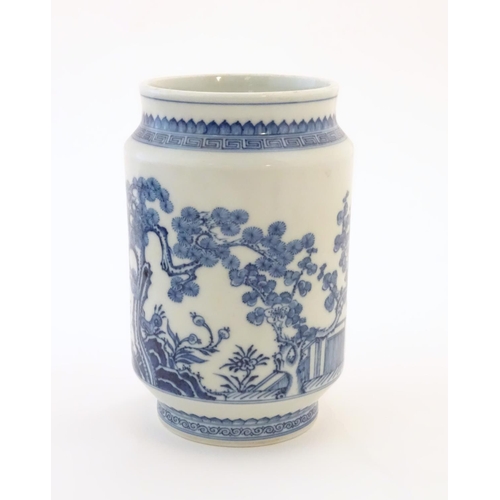 20 - A Chinese blue and white vase of cylindrical form with garden terrace with trees and blossom flowers... 