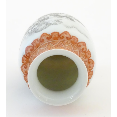 43 - A Chinese small vase with monochrome mountainous landscape detail and orange banded borders. Approx.... 