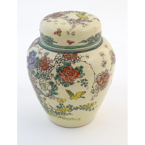 47 - An Oriental ginger jar and cover with inner lid, decorated with flowers and foliage. Possibly Japane... 